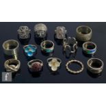 Fourteen assorted silver rings to include puzzle and enamelled examples, some hallmarked some not,