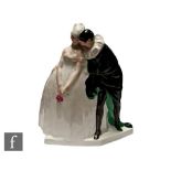 A 1920s Leon Leyritz French Art Deco Commedia dell'arte figure modelled as a lady holding a rose and