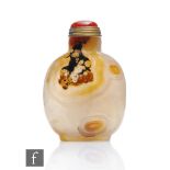 A Chinese 19th Century banded agate snuff bottle, the small bottle on a recessed foot, with