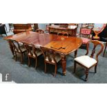 A Victorian mahogany extending dining table, the double moulded edge top over a plain frieze, on