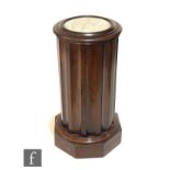 A Victorian mahogany marble top bedside cupboard, the circular lift top opening to reveal a