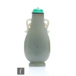 A Chinese Late Qing Dynasty (1644-1912) pale celadon jade snuff bottle in the form of an archaic