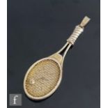 A later 20th Century white metal quartz pendant watch modelled as a tennis racket.