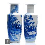 A matched pair of Chinese 19th Century blue and white rouleau vases, decorated in the Kangxi manner,