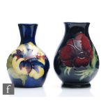 Two Moorcroft vases, the first decorated in the Anemone pattern (marked as a second), the second