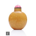 A Chinese 19th Century Jasper quartz snuff bottle of rounded form, the rich golden hue with