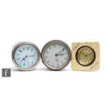 A Smiths car clock, unnumbered, a similar eight day Rotax model and a bedside white Bakelite