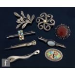 Eight assorted silver brooches to include marcasite set and enamelled examples, some hallmarked some
