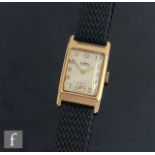 A 9ct hallmarked Roamer manual wind wrist watch, gilt Arabic numerals to a rectangular white dial,