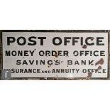 A wall mounted enamel sign 'Post Office Money Order Office, Savings Bank Insurance and Annuity