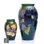 Two Moorcroft vases, both of swollen form, the first decorated in the Clematis pattern, the second