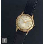 A 9ct hallmarked Garrard wrist watch, gilt batons to a circular silvered dial, case diameter 34mm,