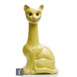 A large early 20th Century novelty vase modelled as a cat with an elongated neck and glazed in