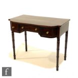 A George IV mahogany dressing table, the breakfront top over three short drawers, brass circular