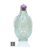 A Chinese 18th Century snuff bottle, the flattened pear form bubble suffused glass bottle, the