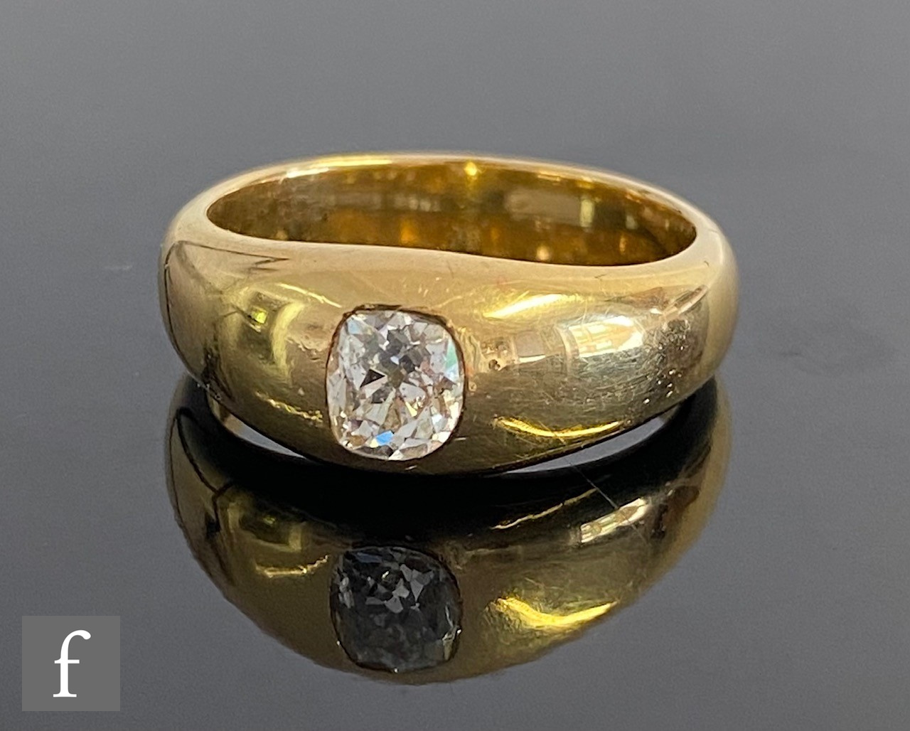 An early 20th Century 18ct diamond solitaire ring, cushioned, collar set, old cut stone, weight