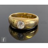 An early 20th Century 18ct diamond solitaire ring, cushioned, collar set, old cut stone, weight