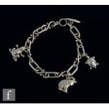 A Danish silver cable link bracelet terminating in t-bar and eye clasp with three animal charms