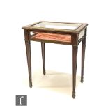 A late 19th Century French mahogany and gilt metal mounted bijouterie cabinet, bevelled glass