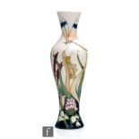 A Moorcroft Pottery vase of slender form decorated in the Grasshopper pattern designed by Phil