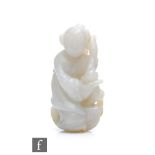 A Chinese 20th Century Jade carving of Daoist immortal figure He Xiangu, the pale green and russet