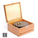 A 19th Century Polyphon playing 9 1/2 inch discs, single comb, in later case with one original and