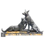 A 20th Century study of two bronzed spelter Alsatians, after L Carvin, on stepped marble plinth