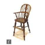 A 19th Century yew wood child?s Windsor chair, pieced splat over an ash seat crinoline stretcher and