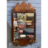 A 19th Century fret carved mahogany wall mirror, the glass plate bordered by an applied moulded edge