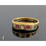 An early 20th Century 18ct ruby and diamond five stone boat shaped ring, weight 3.4g, ring size O.