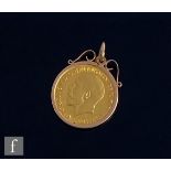 A George V full sovereign dated 1913, loose to a 9ct plain mount, total weight 9.7g.