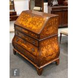 An 18th Century Dutch marquetry inlaid Bombe bureau, the interior fitted with drawers centred by a