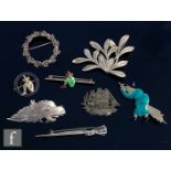 Eight assorted silver brooches to include marcasite set and enamelled examples, some hallmarked some