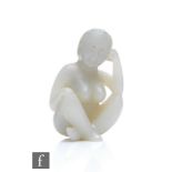 A Chinese Qing Dynasty (1644-1912) jade anatomical or medicine figure, depicting a seated nude