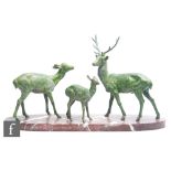 A 20th Century Art Deco bronzed spelter study of a  group, comprising stag, doe and fawn, on brown