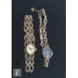 Two hallmarked silver and marcasite set Delvina manual wind wrist watches, one with a silvered dial,