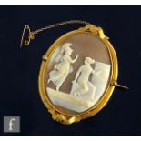 A 19th Century oval cameo brooch depicting a seated woman and a Roman soldier all to a gilt