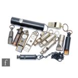 A collection of Acme patent and other whistles including a Boy Scout and two Girl Guide whistles,