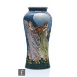 An early 20th Century Doulton Lambeth vase decorated by Margaret Thompson with two ladies in the Art