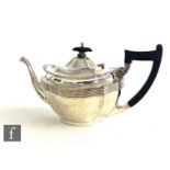 A hallmarked silver boat shaped tea pot with part ribbed decoration and shaped wooden handle, weight
