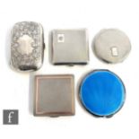 Three hallmarked silver compacts, one with gilt highlights and one with blue enamelled decoration,