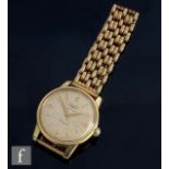 A mid 20th Century Longines gold plated Conquest automatic wrist watch, gilt batons to circular
