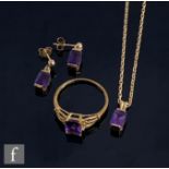 A suite of 9ct jewellery comprising a pendant, earrings and ring, each set with a single emerald cut