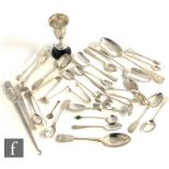 A parcel lot of hallmarked silver flatware with a small silver trophy, St John's Ambulance badges