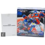 A Takara Tomy Transformers Dark Side of the Moon CH-01 G1 & Movie Optimus Prime, boxed, together