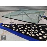 A contemporary glass top coffee table after Ludwig Mies Van Der Rohe, with chromium plated flattened