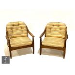 A three-piece post war teak framed stick back lounge suite by Greaves and Thomas,