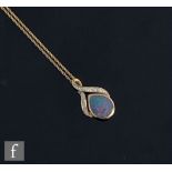 A modern 9ct hallmarked opal and white sapphire set pendant, pear shaped opal below sapphire set