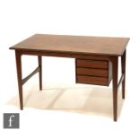 A 1960s Danish teak desk in the manner of Kai Kristiansen, with a bank of three suspended drawers