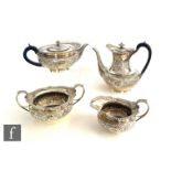 A hallmarked silver four piece tea set with embossed foliate decoration below gadroon borders, total